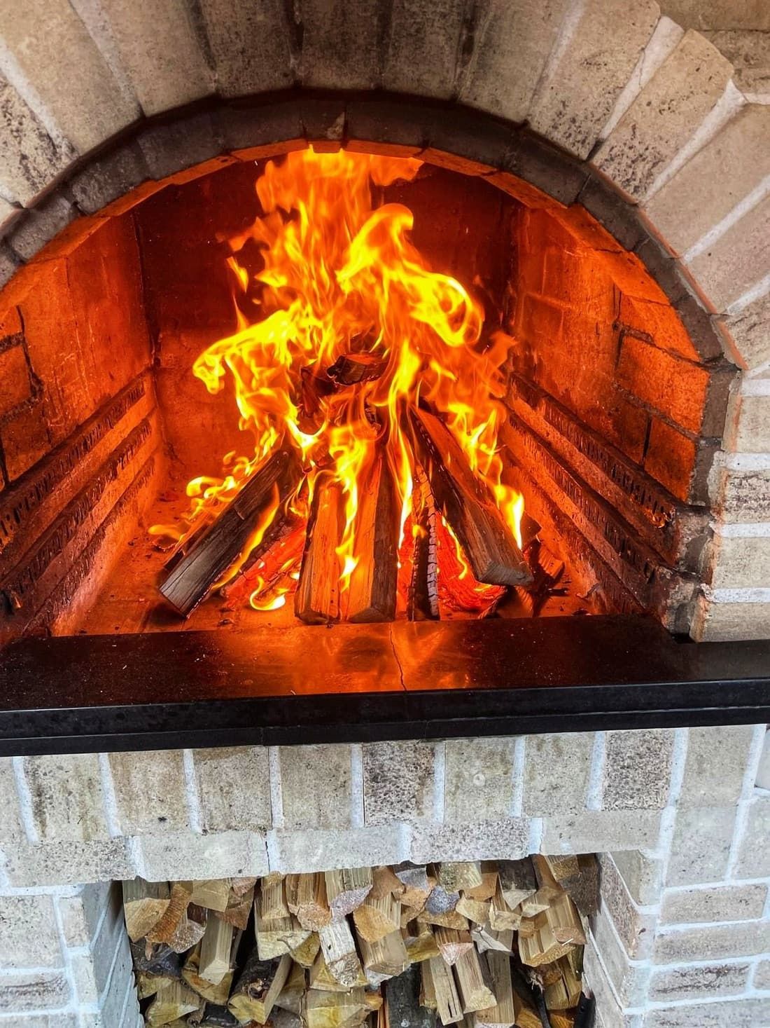 The wood-burning fireplace in the living room
